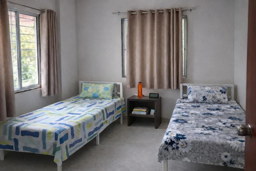 Spacious double sharing room in Parijat PG Pune